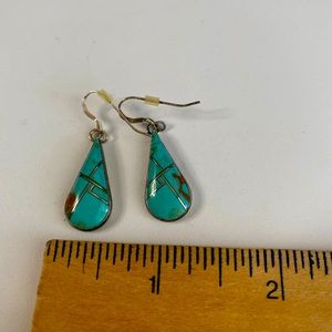 Turquoise and silver drop earrings stamped 925 on earring hooks.